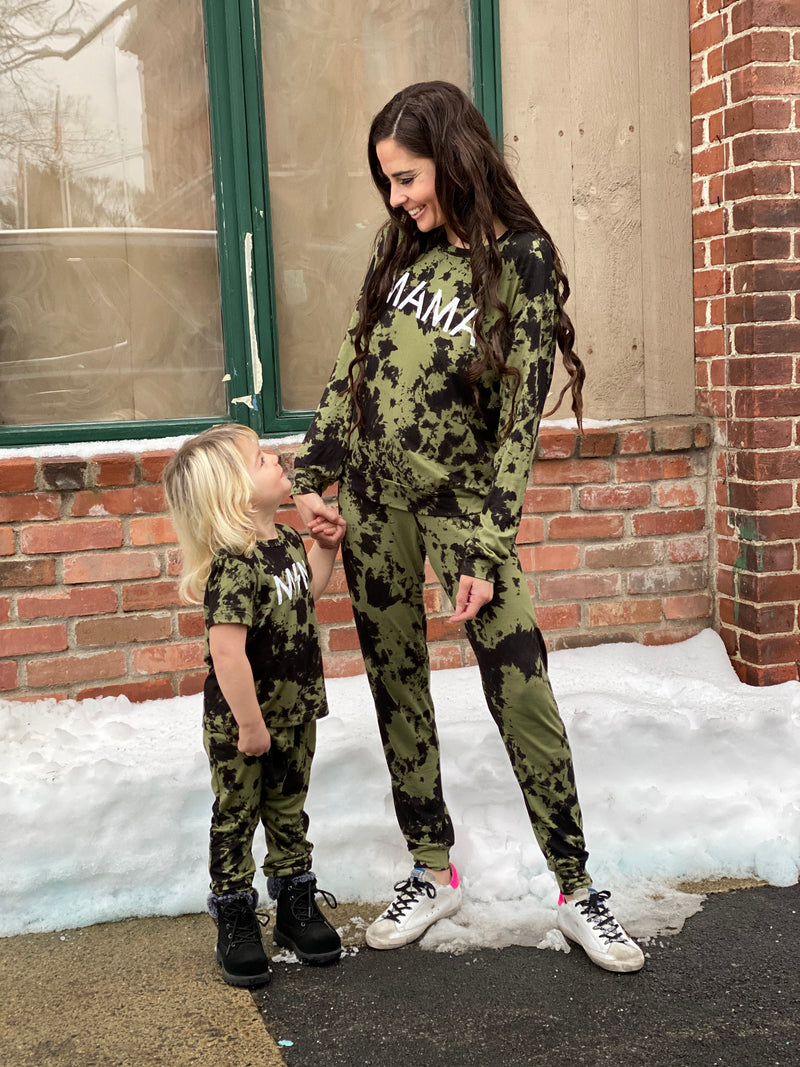 Mom and daughter wearing matching camo outfits.