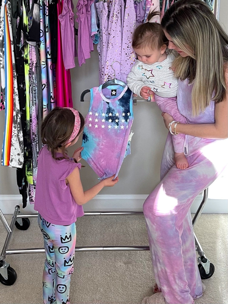Mom with her daughters looking at Pixielane clothing